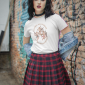 90s-styled-t-shirt-mockup-featuring-a-serious-woman-posing-against-a-graffiti-wall-m12552
