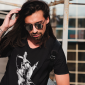 mockup-of-a-long-haired-man-with-an-arm-tattoo-wearing-a-v-neck-tee-43132-r-el2