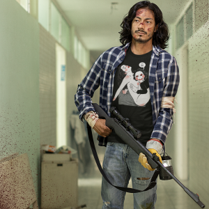 t-shirt-mockup-featuring-a-man-holding-a-sniper-rifle-at-an-abandoned-building-m15766
