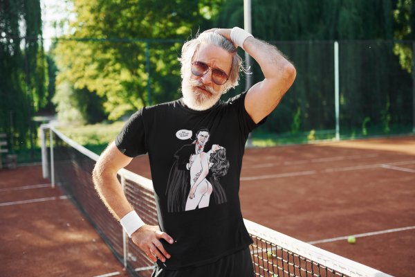 t-shirt-mockup-featuring-a-man-with-sunglasses-at-a-tennis-court-m24257-r-el2 t-shirt-mockup-featuring-a-man-with-sunglasses-at-a-tennis-court-m24257-r-el2