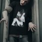 t-shirt-mockup-of-a-zombie-coming-out-from-a-window-29340