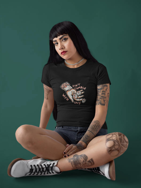 beautiful-edgy-girl-wearing-a-t-shirt-mockup-while-sitting-on-a-pink-studio-a17175