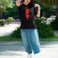 bella-canvas-round-neck-t-shirt-mockup-of-a-stylish-woman-standing-in-the-street-m40210