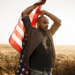 mockup-of-a-bearded-man-holding-an-american-flag-outdoors-m25994-r-el2