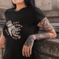 mockup-of-a-tattooed-woman-wearing-a-tee-mockup-while-against-a-concrete-wall-a17171
