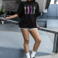 oversized-t-shirt-mockup-of-a-serious-woman-in-the-street-wearing-sneakers-m38284