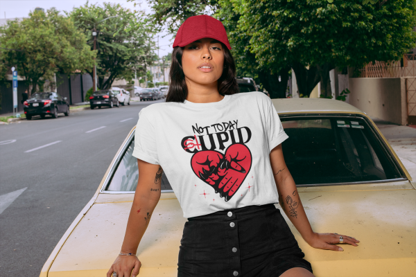 t-shirt-mockup-of-a-woman-with-a-dad-hat-sitting-on-an-old-car-28607