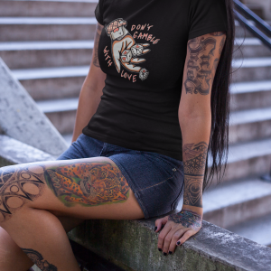 tattooed-cropped-face-girl-wearing-a-t-shirt-mockup-sitting-near-concrete-stairways-a17148